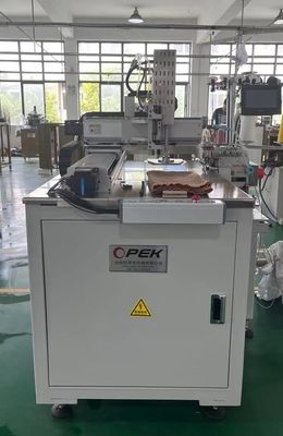 Machine à coudre électrique automatique programmable et OPKE-300HS pour la production de vêtements